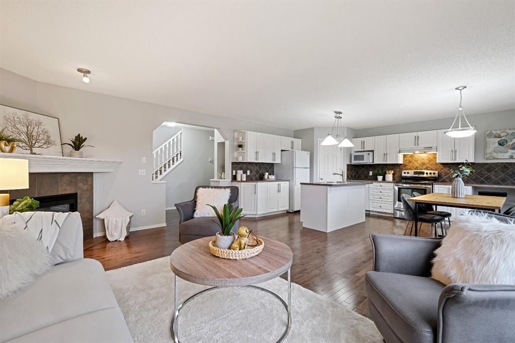 Calgary Living room walls, mantle, railing and Kitchen cupboards painted by Johnny B's Painting
