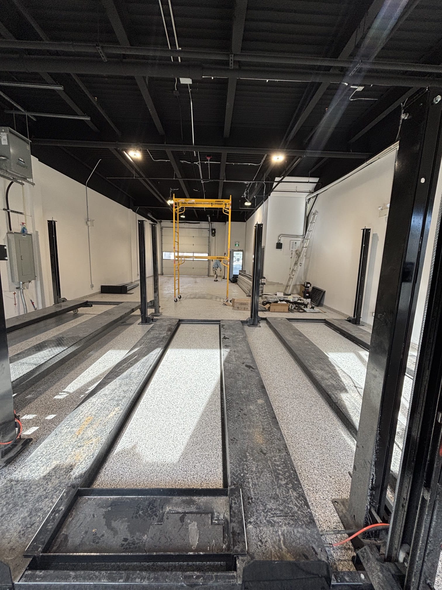 Commercial warehouse Q decking sprayed black walls painted white